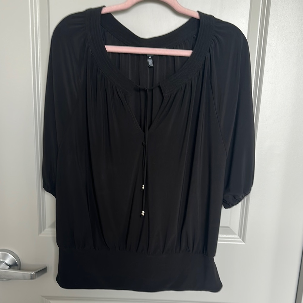 White House Black Market Chic Black Blouse with Sleek Design Jersey Knit